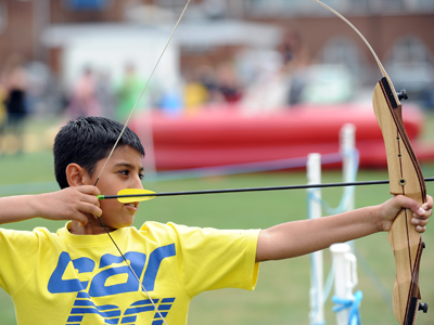 Boy using a bow and arrow